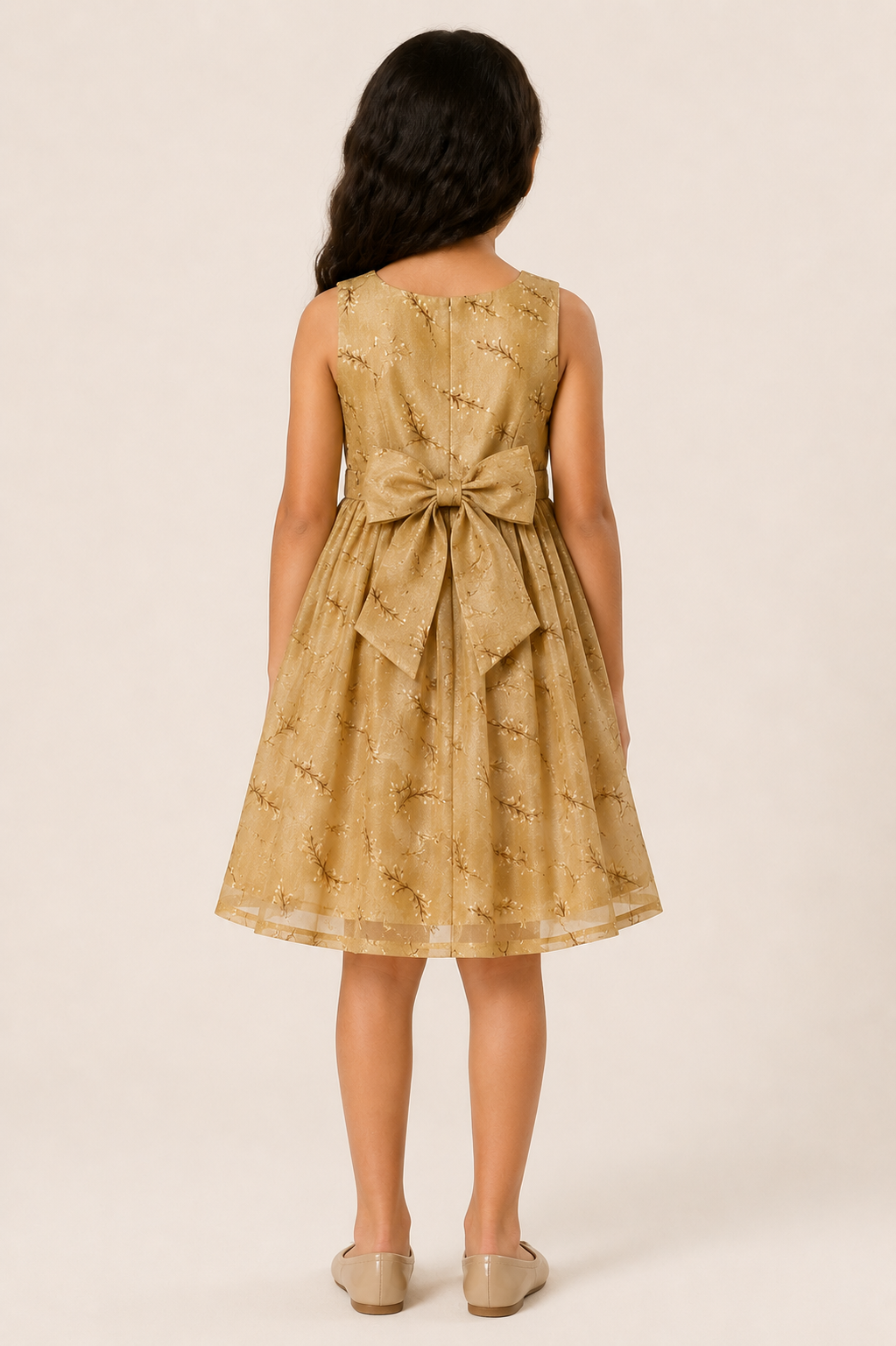 Girl wearing a golden beige sleeveless floral party frock with a waist bow from Lana Fashion Studio
