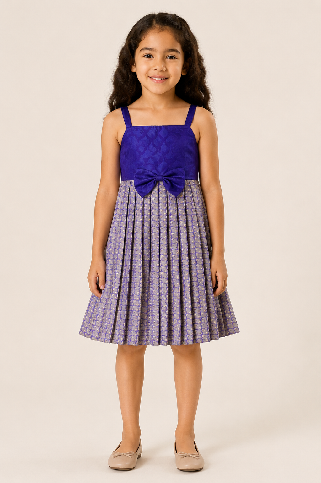Girl wearing a royal blue sleeveless party frock with a pleated lavender skirt and front bow from Lana Fashion Studio