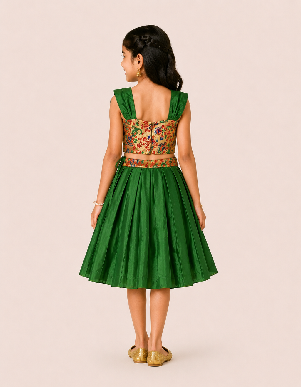 Girl wearing a green pleated lehenga with a floral printed crop choli from Lana Fashion Studio
