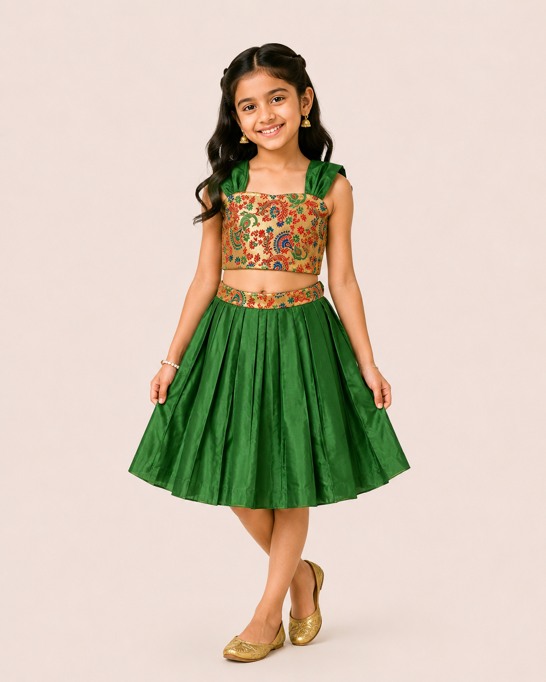 Girl wearing a green pleated lehenga with a floral printed crop choli from Lana Fashion Studio