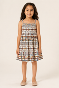 Girl wearing an ivory white sleeveless geometric printed cotton frock from Lana Fashion Studio